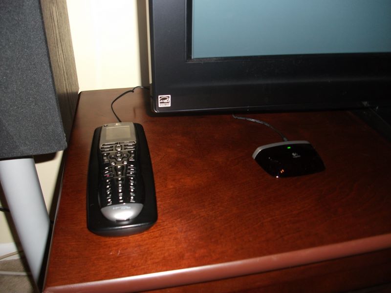 dscf1643.jpg Harmony One in the cradle and the PS3 adapter